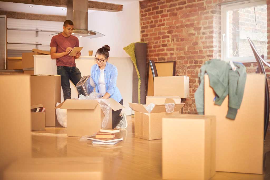 Couple with packing boxes